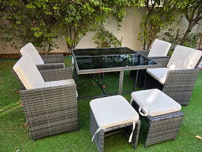 8-piece grey rattan outdoor dining set with glass table and cushions. Original crom ACE