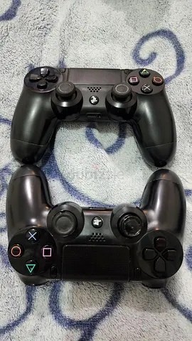 Pair of Black Sony DualShock 4 Controllers - Working Condition
