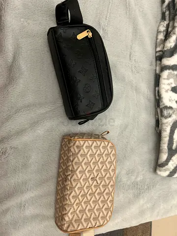 Pair of designer toiletry/waist pouches — black Louis Vuitton-style and beige Goyard-style