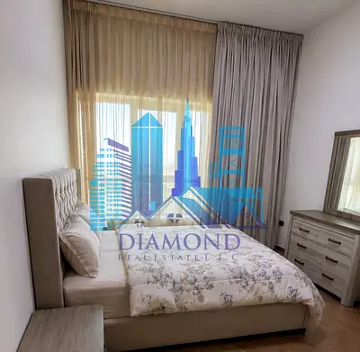 For sale A two-bedroom apartment with a living room, including furniture and décor, featuring an open view, located in the Ajman Pearl Towers.