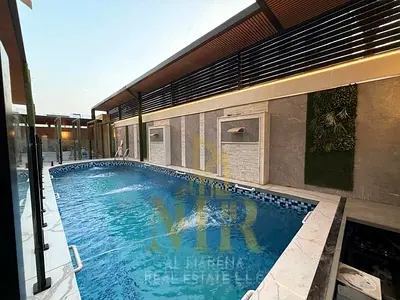 Luxury villa for sale in Al Aaliyah | 6 master bedrooms | Swimming pool and elevator | Built-up are