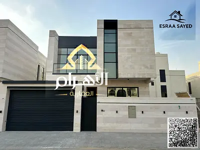Villa for sale in Ajman, Al Bahia area. It consists of 5 master bedrooms, a majlis, 2 living rooms, and a maid's room. Freehold ownership for all nati
