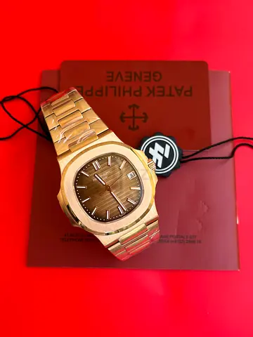 Patek Philippe Nautilus Rose Gold 5711/1R-001 wristwatch featuring an 18k rose gold case, bracelet