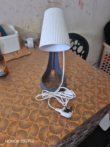 Small modern bedside table lamp with white pleated shade