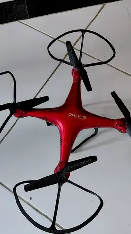 Red quadcopter drone with camera