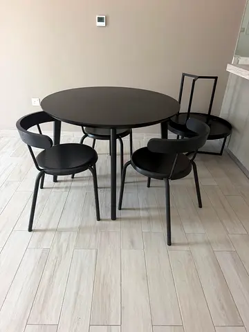 Modern black metal round dining table with 4 matching chairs and coffee table set