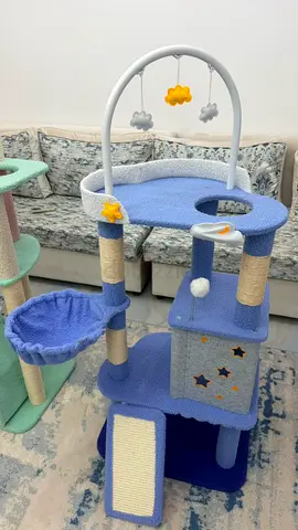 Blue multi-level cat tree with bed, scratch ramp and toys