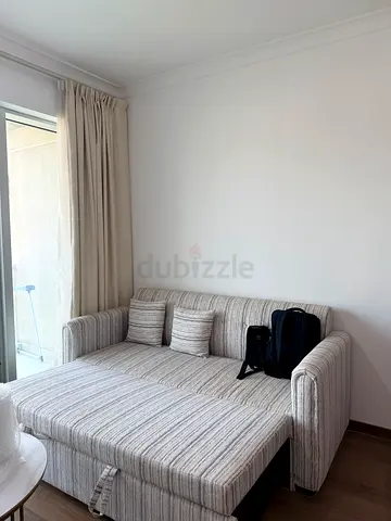 Light grey striped 2-seater sofa with cushions