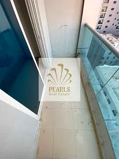 Luxury 2BHK near Ruler's Palace, Ajman. Fitted kitchen, 2 baths, high-end finishing & easy payment o