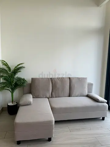 Compact 2-seater beige fabric sofa — good condition