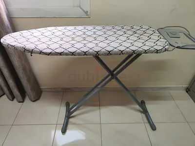 Sturdy ironing board with cover and sleeve rest - good condition