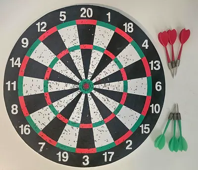 Used wall-mounted dartboard set with 6 darts (red & green) - good condition