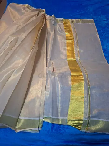 Light beige silk saree with gold-bordered pallu - gently used.ready to wear saree