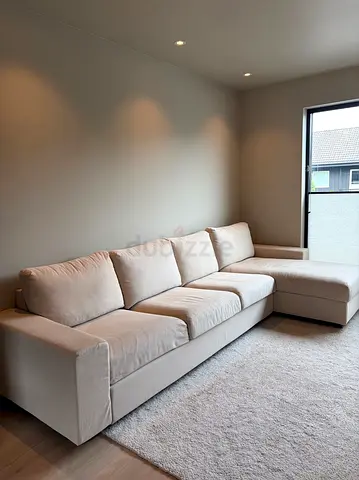 Light beige L-shaped fabric sofa bedwith chaise — good condition