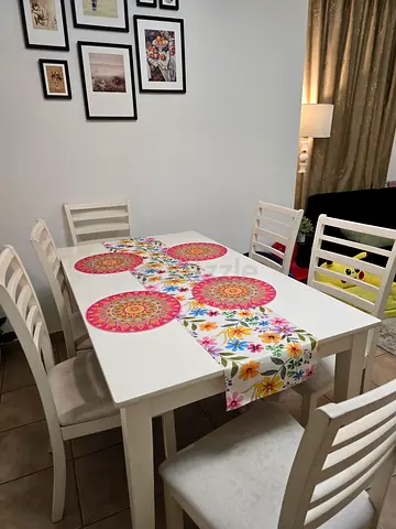 White Wooden Ikea Dining Table with 6 Chairs. Chairs needs cleaning but there is no damage.