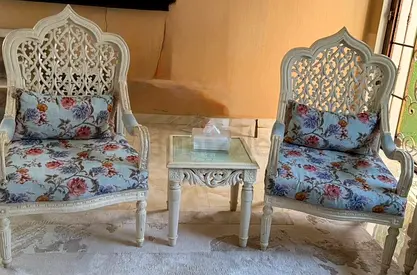 Pair of Ornate Carved Chairs with Matching Side Table