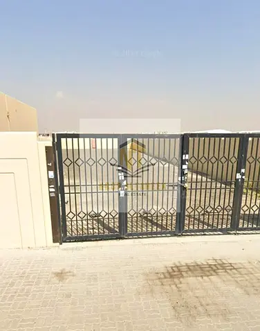 A walled yard located on Street 36 in the Al-Ikraab and Auctions area of Al Sajaa. It offers freehold ownership for Arab nationals and 99-year lease