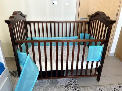 Solid Wood Baby Crib in Dark Brown with Mattress and Bumpers, has whiles,both sides rails