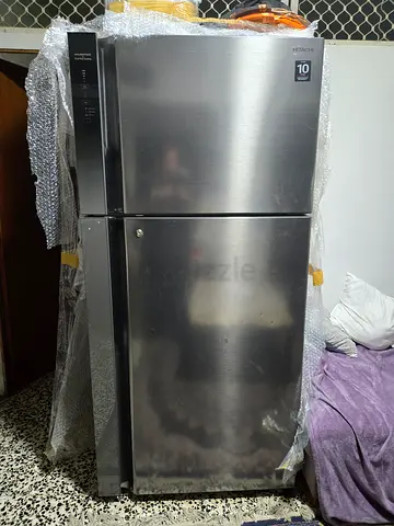 Used stainless steel side-by-side refrigerator - good working condition