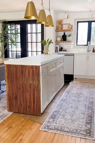 Modern kitchen island with wooden slat ends and white countertop