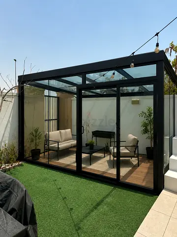 Glass-enclosed Outdoor Sunroom / Garden Room with Black Frame