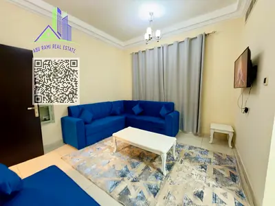 Clean, newly furnished 2-bedroom apartment in Al Rawda 1, with 2 bathrooms, balcony and central AC, behind Al Hamidiya Police Station, with easy acces