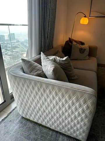 Light grey quilted 3-seater sofa in good condition