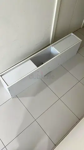 Slim white wall-mounted storage cabinet / shelf unit