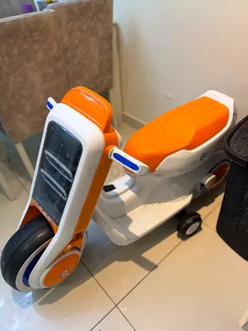 Kids two seat motor scooter - orange and white, good condition with charger