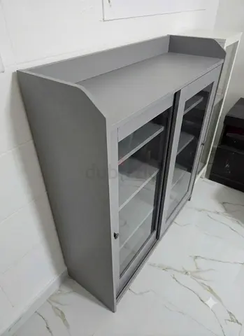 Ikea Gray glass-front storage cabinet for Sale
