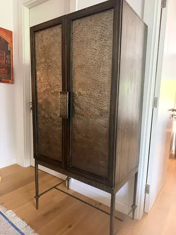 Brass Cabinet with Metal Legs and Textured Panel Doors