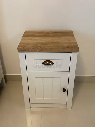 Small wooden bedside cabinet with drawer and door