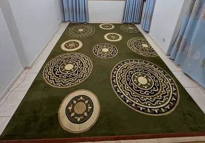 Large green patterned area rug — good condition, 3m x 5m (approx.)
