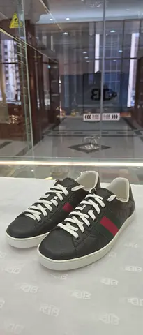 Black leather low-top sneakers with red-green stripe - size available