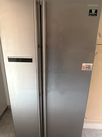 Samsung Side-by-Side Refrigerator, Stainless Steel, Good Condition except small leak freezer door.
