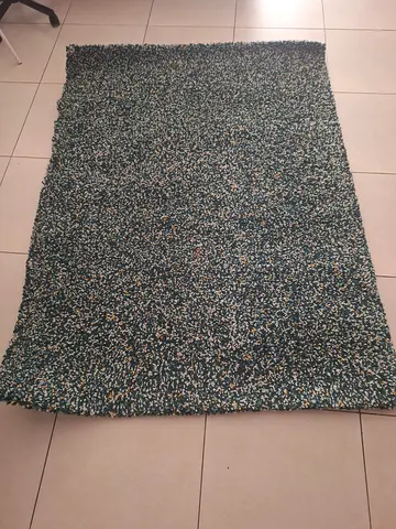 Green textured $%&! rug — good condition, medium size
