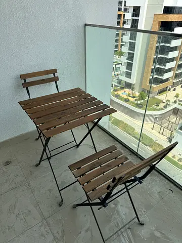Compact folding bistro table and 2 chairs - wood slat with cushions
