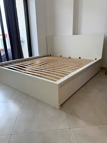 IKEA malm king size storage bed frame with IKEA mattress  Available in excellent condition  Two stor
