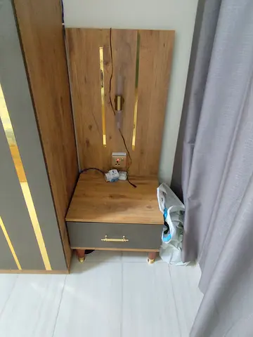 Wooden bedside table with headboard panel and drawer - good condition