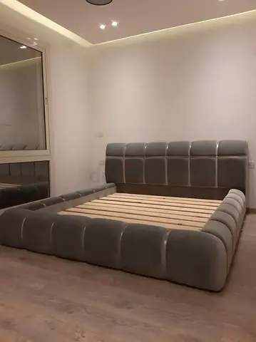 Modern low-profile upholstered king bed frame in grey