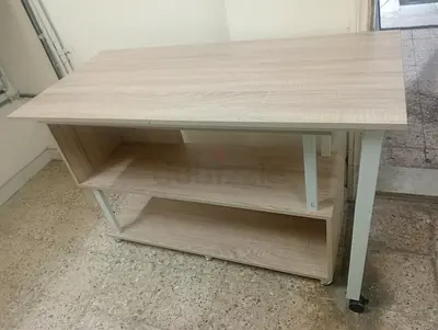 Table with moving shelf