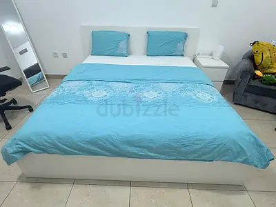 White platform double bed with mattress and bedside table - good condition.(negotiable)