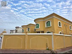 Two adjacent villas for sale in Ajman, suitable for residential or investment purposes. Villa 1: Cor