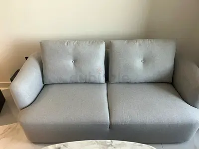 Light grey two-seater sofa never used- brand new