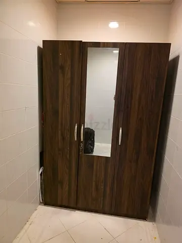 Dark wood 3-door wardrobe with mirror — good condition