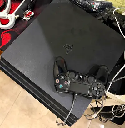 Sony PlayStation 4pro  Slim with DualShock 4 controller - used but makes fan noise