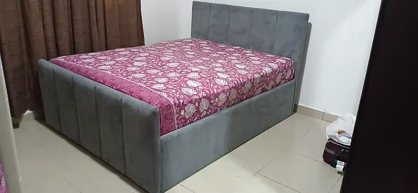 Gray upholstered double bed frame with storage-style base (good condition)