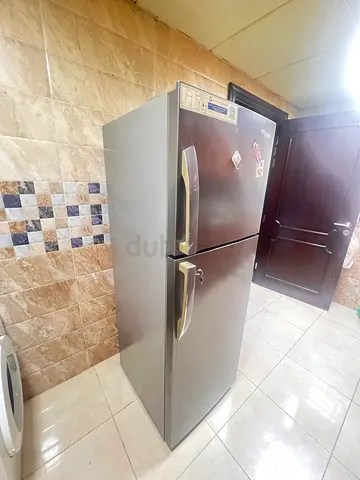 Silver double-door refrigerator, great working condition