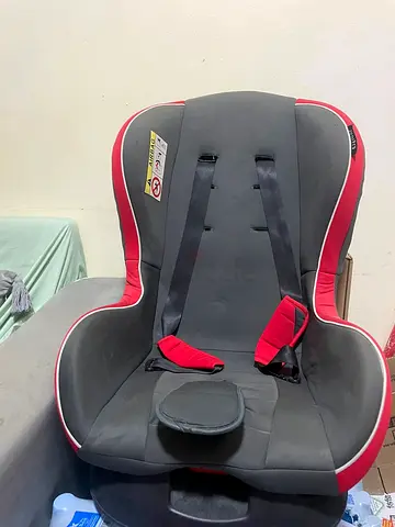 Used red and grey convertible child car seat - good condition