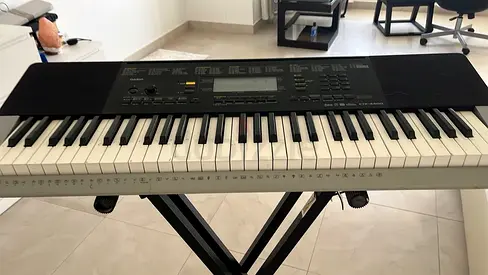 Casio electronic keyboard with stand - good working condition